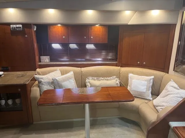 Slide: The Image of Luxurious 2008 Cruisers Yachts 460 Express interior with cozy seating and elegant wood finishes. - 10