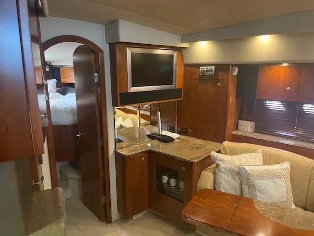 Slide: The Image of Luxurious 2008 Cruisers Yachts 460 Express interior with cozy seating and modern amenities. - 13