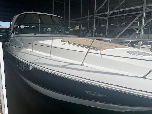 Slide: The Image of 2008 Cruisers Yachts 460 Express in marina, side view under shelter. - 2