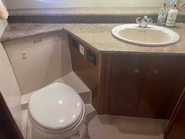 Slide: The Image of 2008 Cruisers Yachts 460 Express bathroom with sink and toilet. - 22