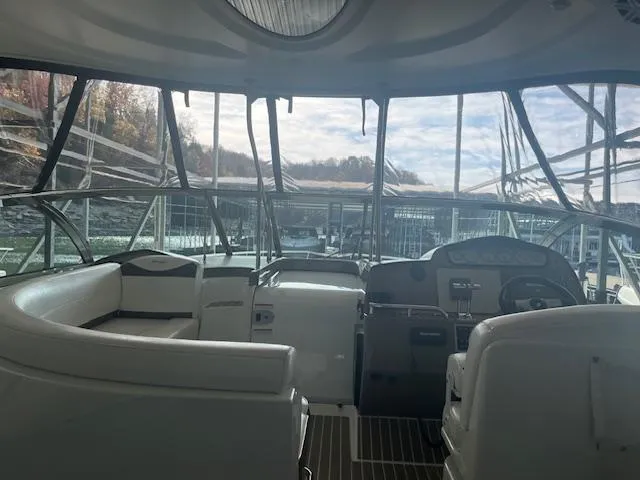 Slide: The Image of Interior view of 2008 Cruisers Yachts 460 Express, featuring helm and seating area. - 26