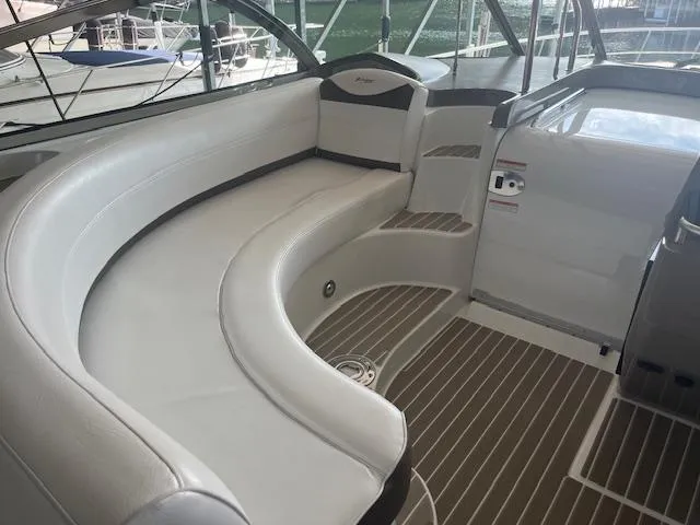 Slide: The Image of 2008 Cruisers Yachts 460 Express interior with curved seating and sleek design. - 29