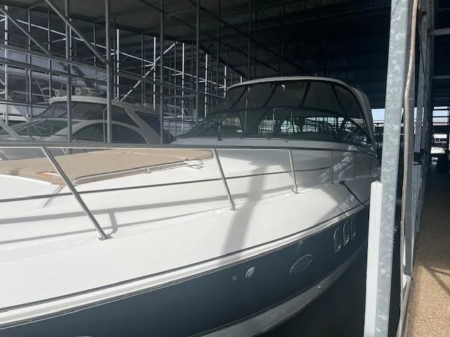 Slide: The Image of 2008 Cruisers Yachts 460 Express in marina storage, side view. - 3