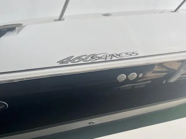 Slide: The Image of 2008 Cruisers Yachts 460 Express boat side view with logo. - 4
