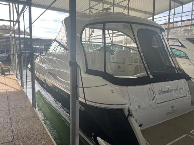 Slide: The Image of 2008 Cruisers Yachts 460 Express docked in a covered marina. - 5