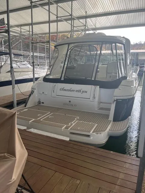 Slide: The Image of 2008 Cruisers Yachts 460 Express docked in a covered marina. - 6