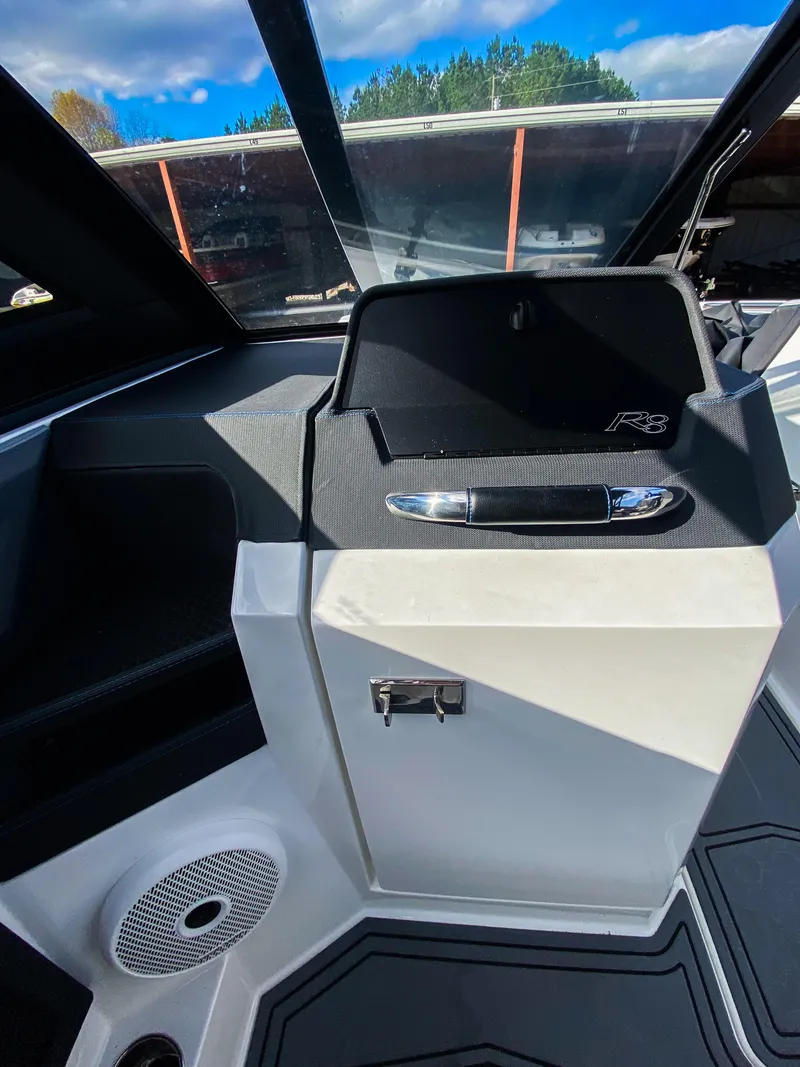 Slide: The Image of 2023 Cobalt R8 Surf boat interior with sleek dashboard design. - 14