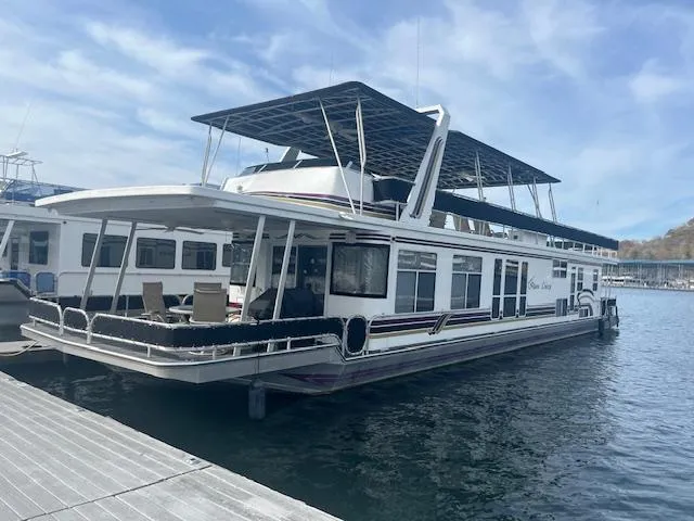 The Image of 2000 Sharpe 16X80 houseboat docked on a sunny day. - 0