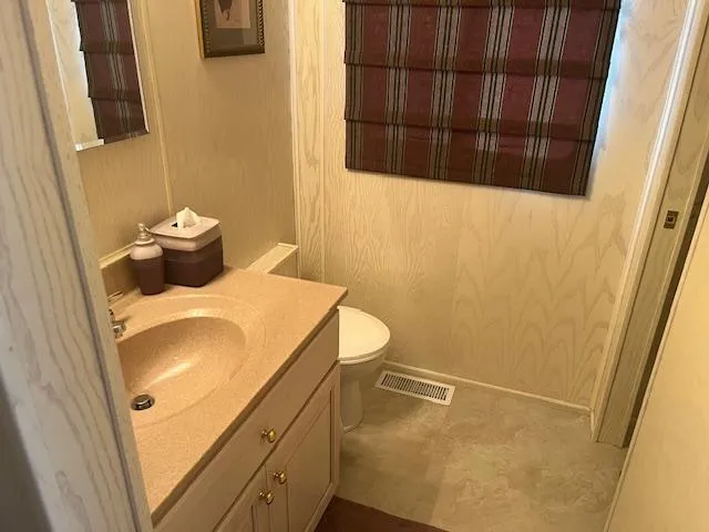 Slide: The Image of Bathroom interior of 2000 Sharpe 16X80 Houseboat with sink, toilet, and window shade. - 10