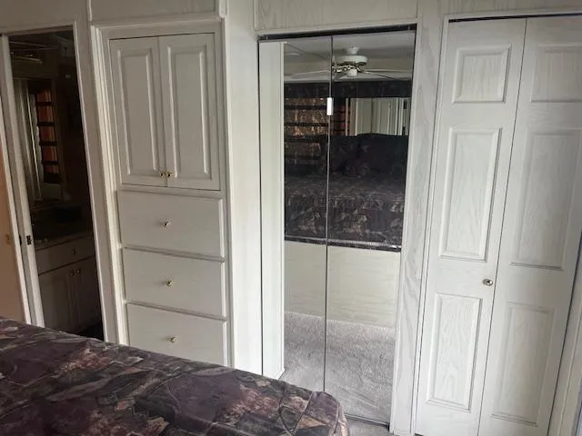 Slide: The Image of Interior of 2000 Sharpe 16X80 houseboat with mirrored closet and built-in drawers. - 14