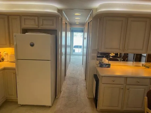 Slide: The Image of Interior of 2000 Sharpe 16X80 houseboat with kitchen and hallway view. - 25