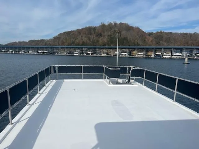 Slide: The Image of 2000 Sharpe 16X80 houseboat deck with scenic lake and marina view. - 30