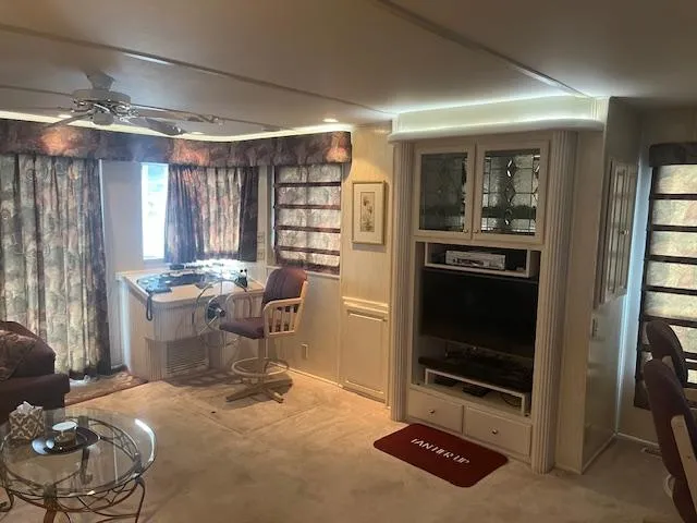 Slide: The Image of Interior of 2000 Sharpe 16X80 houseboat with cozy living area and entertainment center. - 4