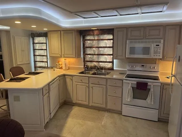 Slide: The Image of Modern kitchen in 2000 Sharpe 16X80 houseboat with white cabinetry and appliances. - 8