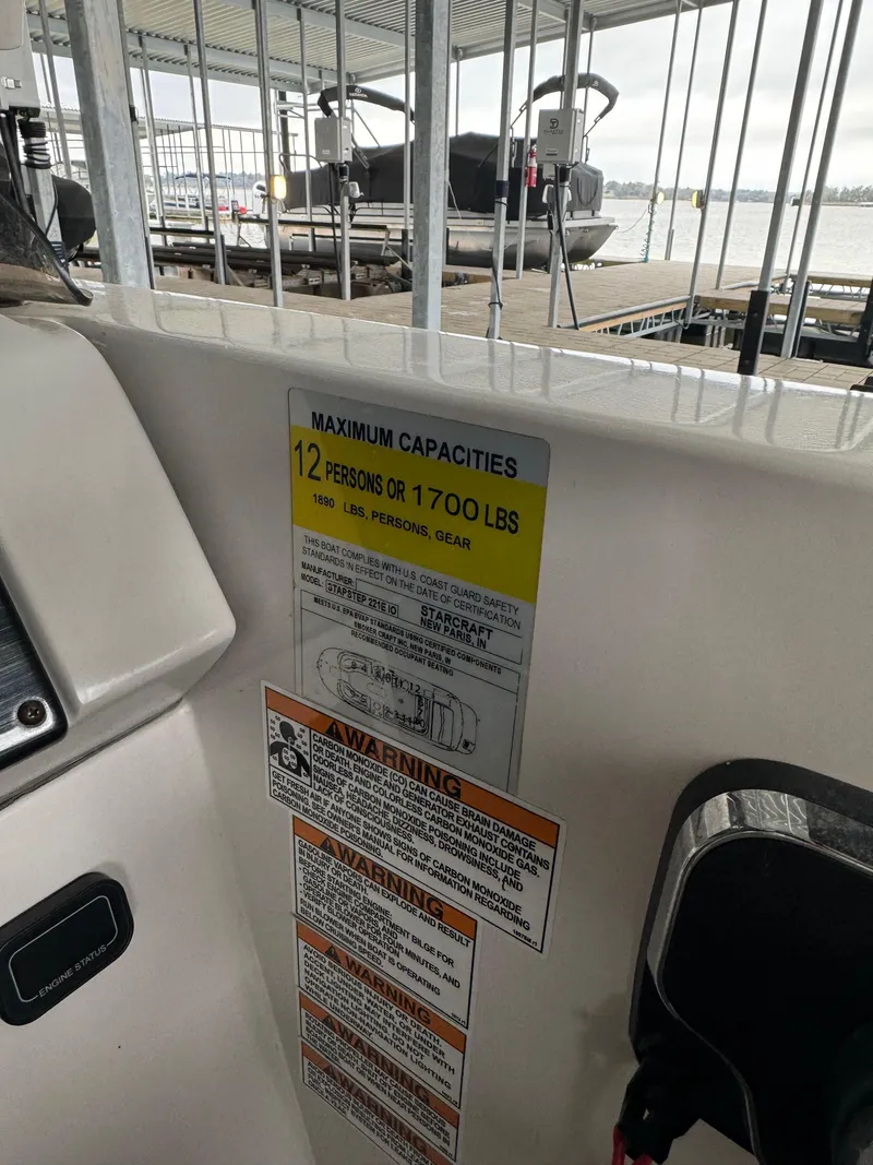 Slide: The Image of 2018 Starcraft Starstep 221 boat capacity label, maximum 12 persons or 1700 lbs. - 12