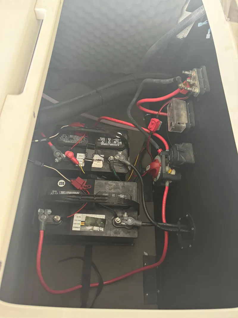 Slide: The Image of Battery compartment of 2018 Starcraft Starstep 221 with wiring and connections visible. - 8