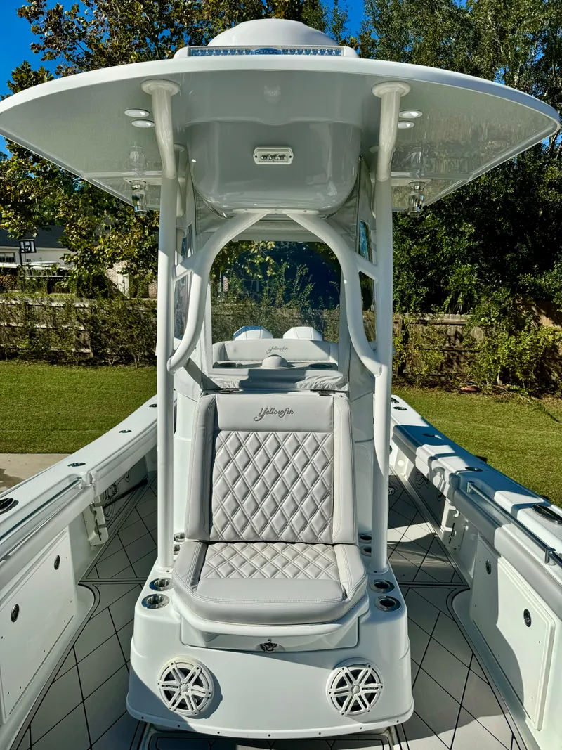 Slide: The Image of 2020 Yellowfin 26 Hybrid boat with cushioned seating and sleek design. - 15