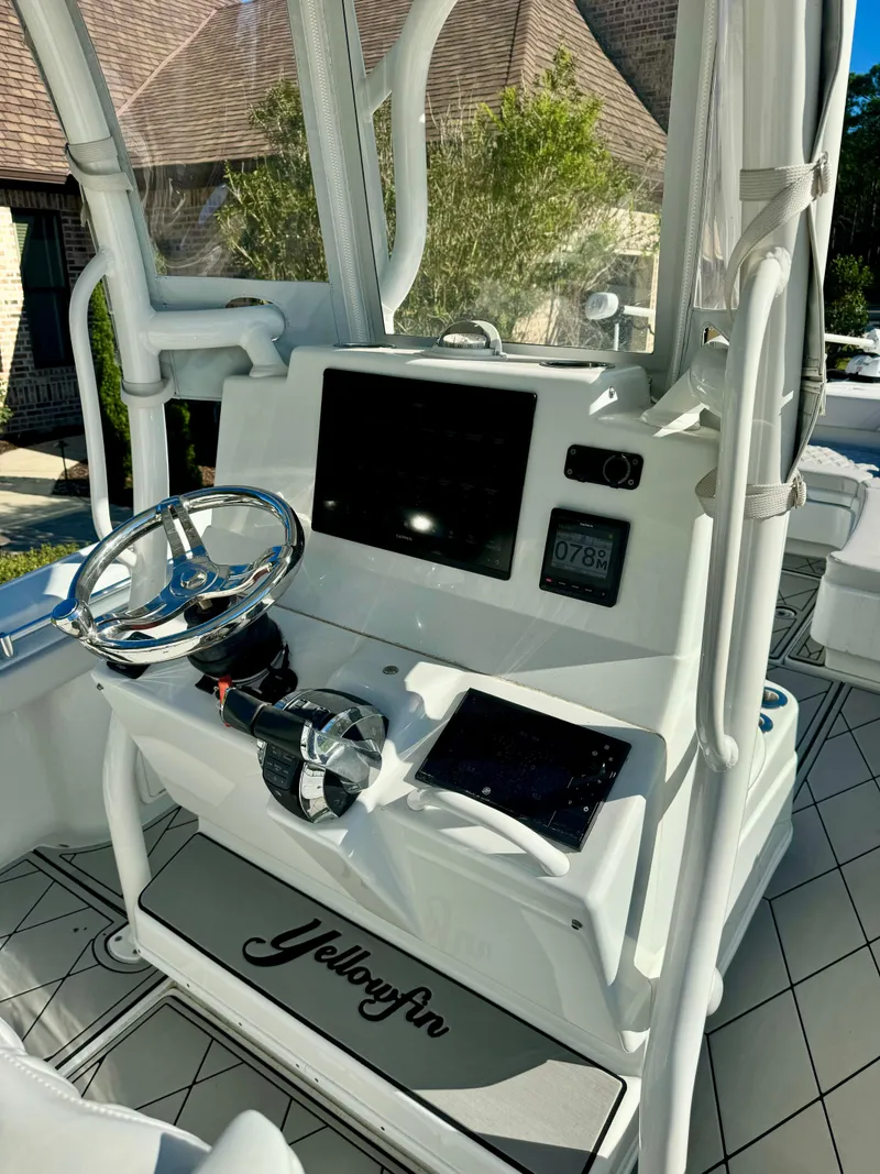 Slide: The Image of 2020 Yellowfin 26 Hybrid boat console with steering wheel and digital displays. - 8