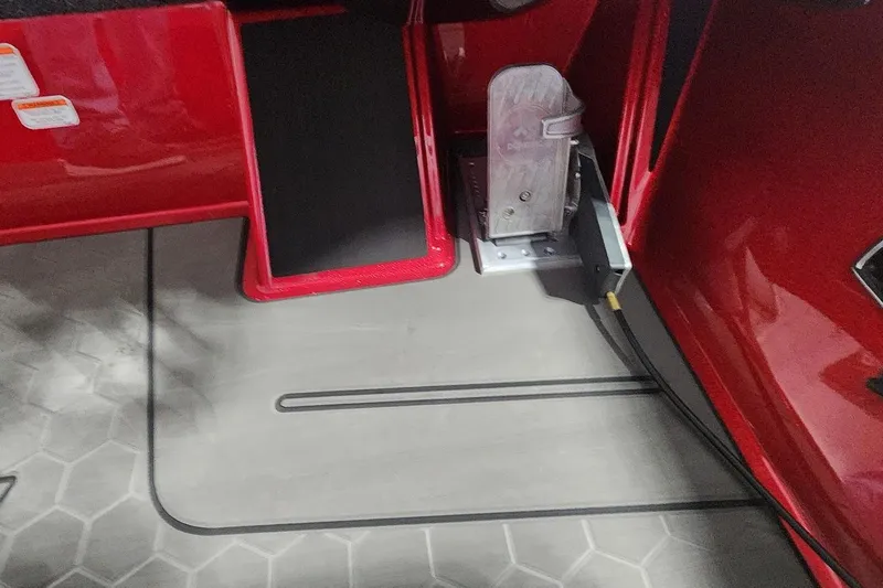 Slide: The Image of Red interior of 2025 Nitro Z19 boat with pedal and footrest. - 14