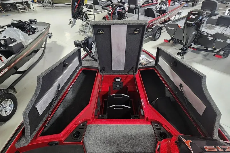 Slide: The Image of 2025 Nitro Z19 boat interior with open storage compartments in showroom. - 8