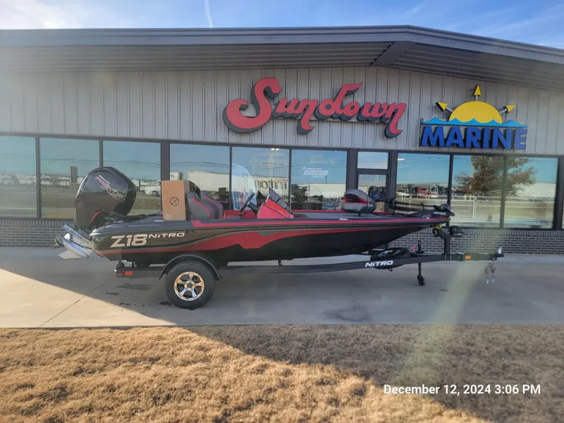 Slide: The Image of 2025 Nitro Z18 boat displayed at Sundown Marine dealership. - 0