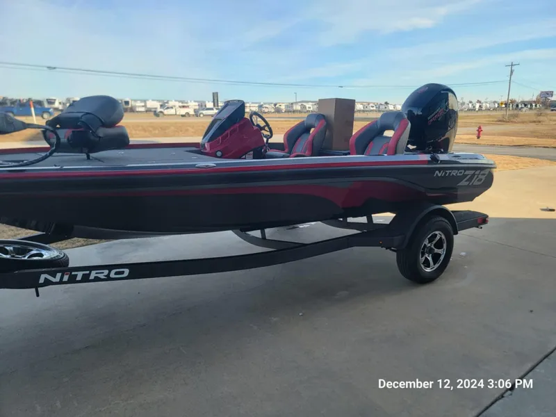 Slide: The Image of 2025 Nitro Z18 boat on trailer, parked outdoors, side view. - 1