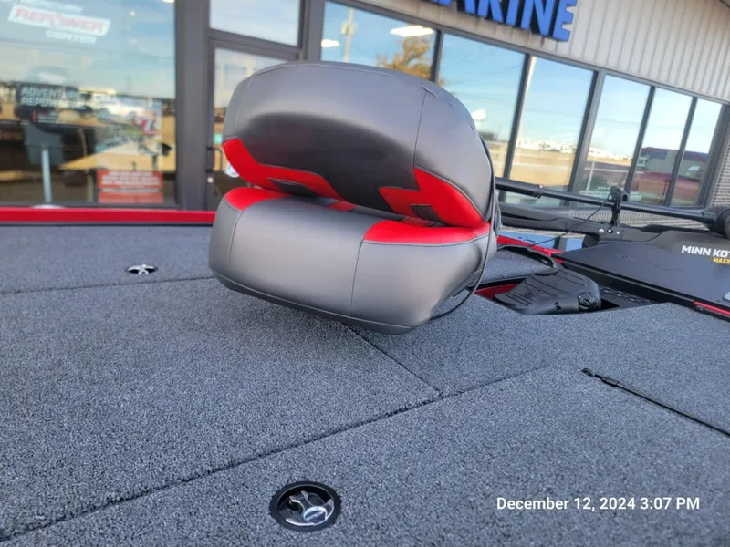 Slide: The Image of Nitro Z18 2025 boat seat with red accents on a textured deck. - 3