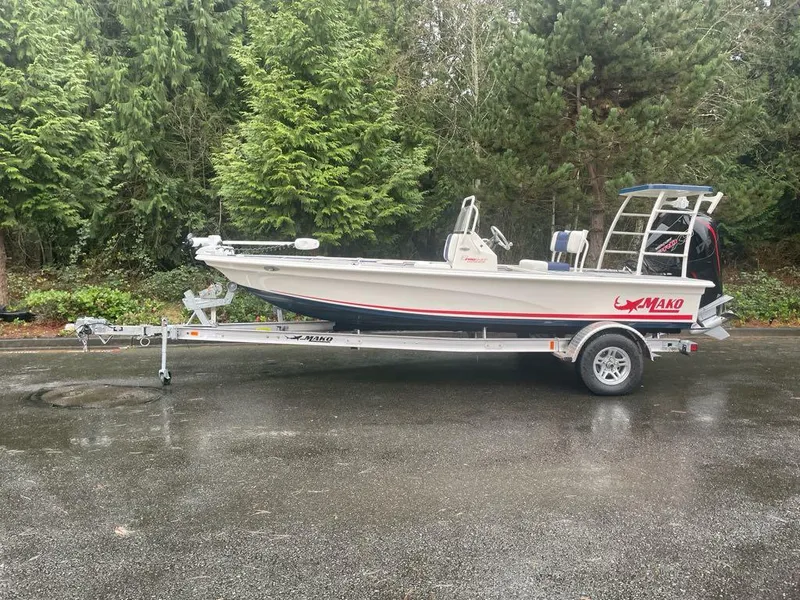 The Image of 2025 Mako 18 Pro Skiff Patriot Edition on trailer, parked outdoors. - 0