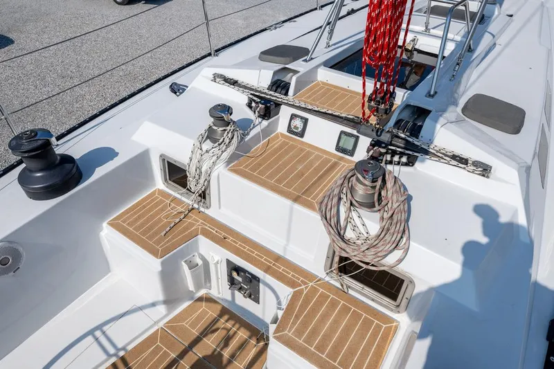 Slide: The Image of Baltic 42 sailboat deck, 1977 model, featuring winches and ropes on teak flooring. - 14