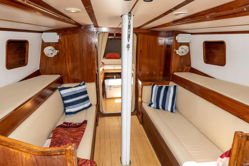 Slide: The Image of Interior of 1977 Baltic 42 sailboat with wooden finish and cozy seating. - 16