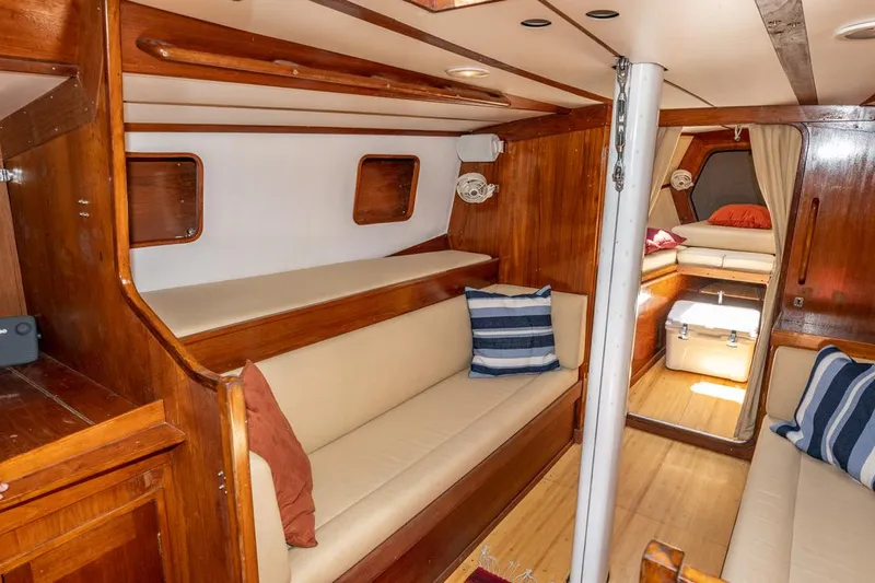 Slide: The Image of Cozy interior of 1977 Baltic 42 sailboat with wooden finishes and comfortable seating. - 17