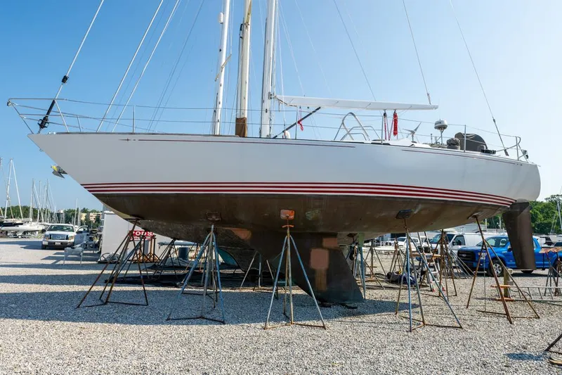 Slide: The Image of Baltic 42 sailboat from 1977 on stands in a boatyard. - 2