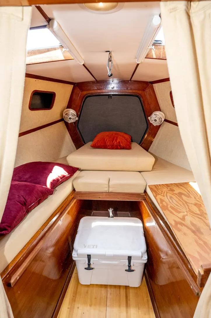 Slide: The Image of Cozy cabin interior of 1977 Baltic 42 sailboat with cushions and wooden finish. - 26