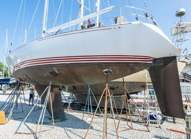 Slide: The Image of Baltic 42 sailboat from 1977 on dry dock, supported by stands. - 3