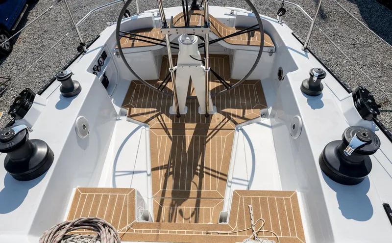 Slide: The Image of Cockpit of 1977 Baltic 42 sailboat with wooden deck and steering wheel. - 4