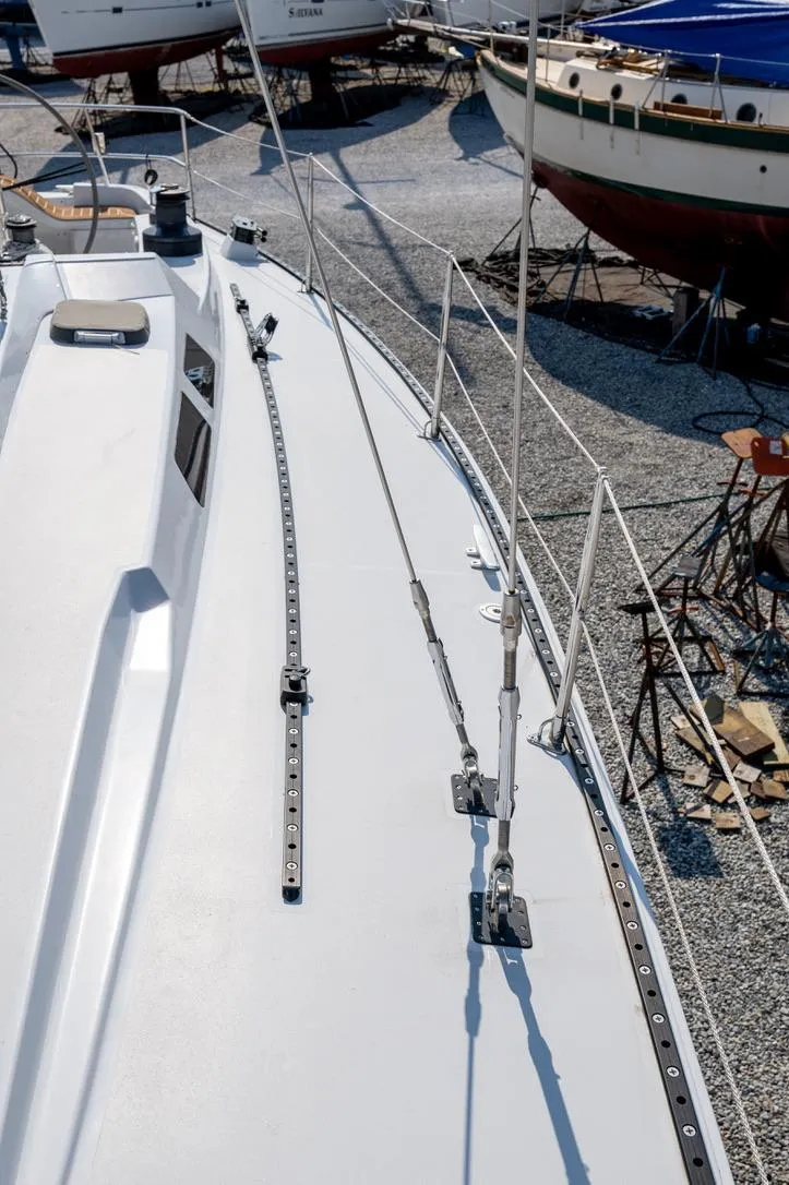 Slide: The Image of 1977 Baltic 42 sailboat deck, docked with other boats in a marina. - 6