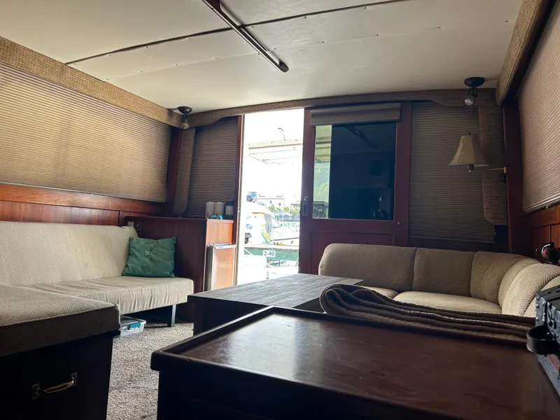 Slide: The Image of Cozy 1989 Post 43 yacht interior with beige seating and wooden accents. - 19