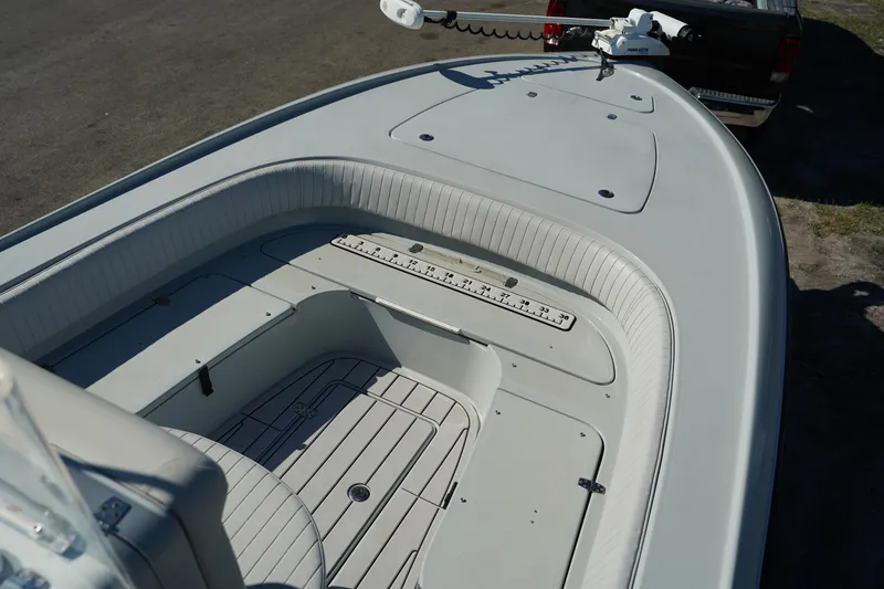 Slide: The Image of 2016 Contender 25 Bay boat interior with spacious seating and clean deck design. - 11