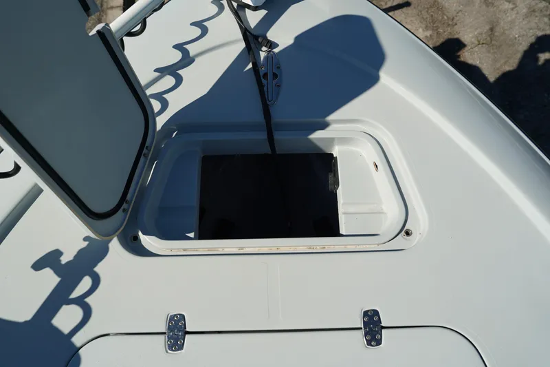 Slide: The Image of Open hatch on 2016 Contender 25 Bay boat deck. - 15