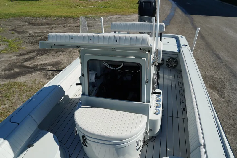 Slide: The Image of 2016 Contender 25 Bay boat interior with seating and console. - 16