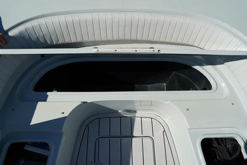 Slide: The Image of Contender 25 Bay 2016 boat interior with open hatch and seating area. - 21