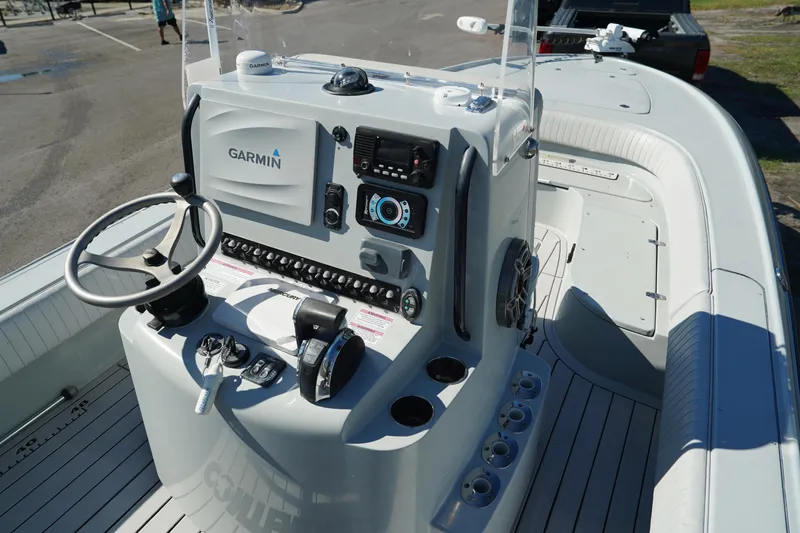 Slide: The Image of 2016 Contender 25 Bay boat dashboard with Garmin navigation system. - 22