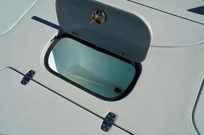Slide: The Image of 2016 Contender 25 Bay boat storage compartment with open hatch. - 31