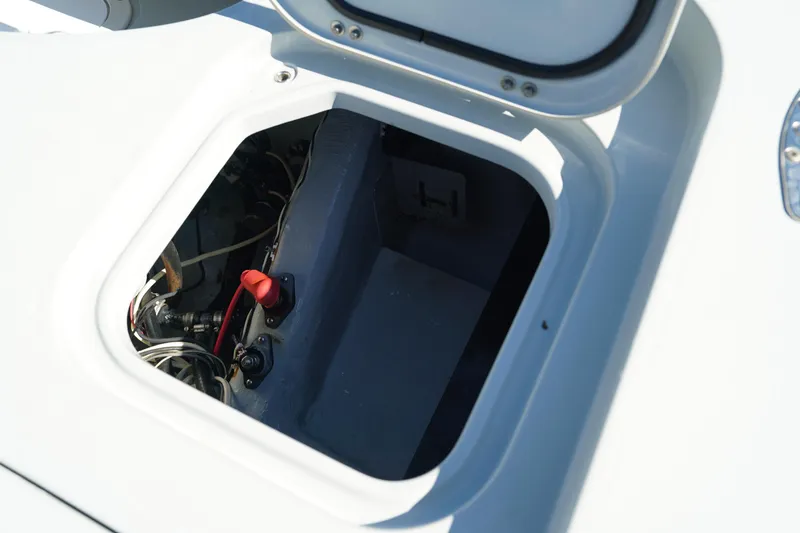 Slide: The Image of Open hatch of 2016 Contender 25 Bay boat showing internal compartment. - 32