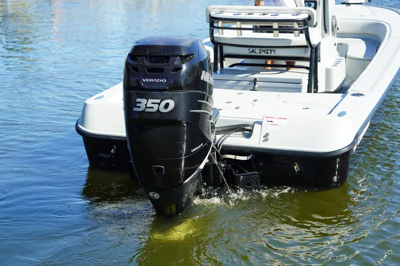 Slide: The Image of 2016 Contender 25 Bay boat with Mercury Verado 350 engine on water. - 4