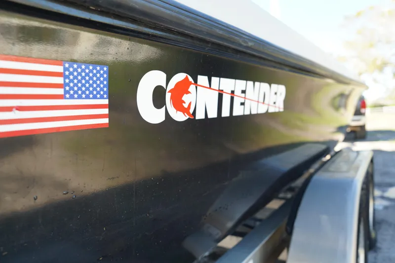 Slide: The Image of 2016 Contender 25 Bay boat with American flag decal on the side. - 41