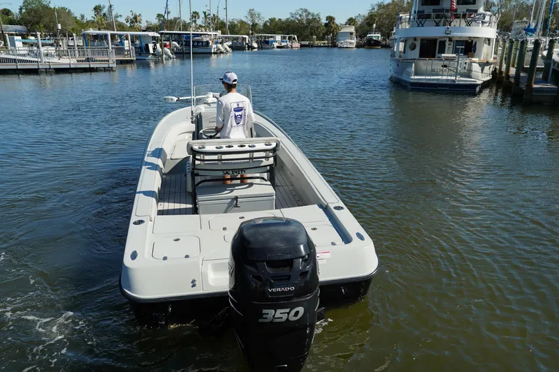 Slide: The Image of 2016 Contender 25 Bay boat with 350 horsepower engine on a calm marina. - 5
