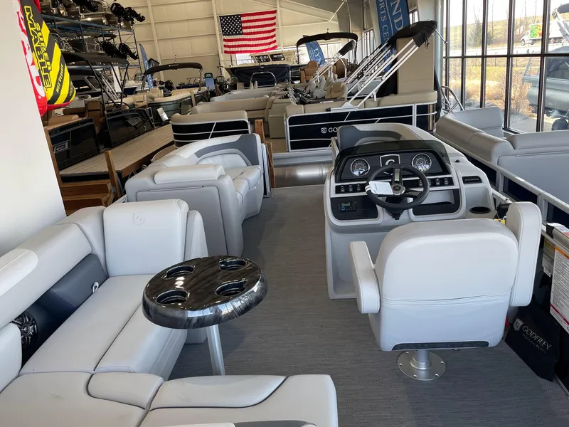 Slide: The Image of 2025 Godfrey Sweetwater 2086 C pontoon boat interior with modern seating and control panel. - 14