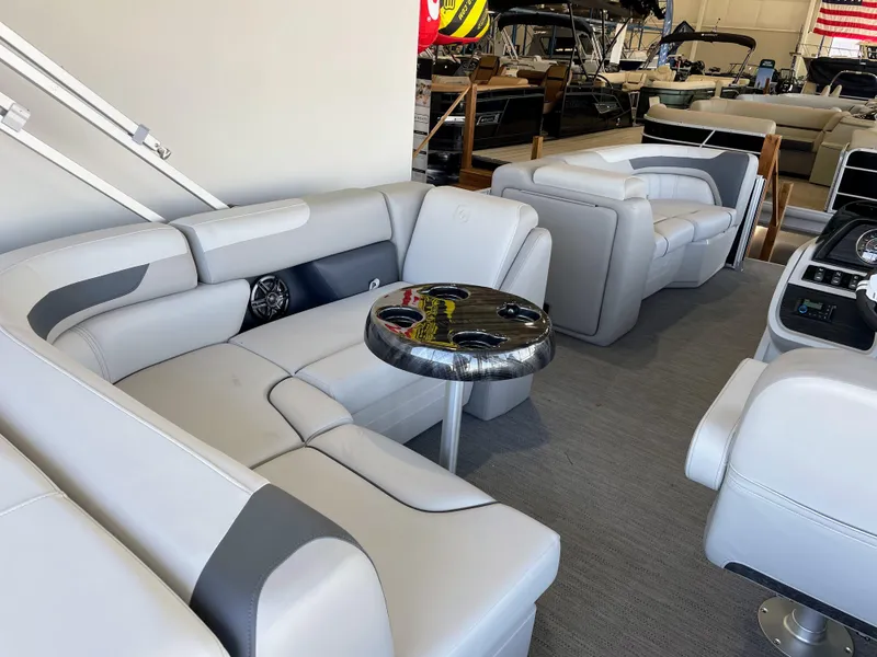 Slide: The Image of Luxurious interior of 2025 Godfrey Sweetwater 2086 C pontoon boat with plush seating. - 16