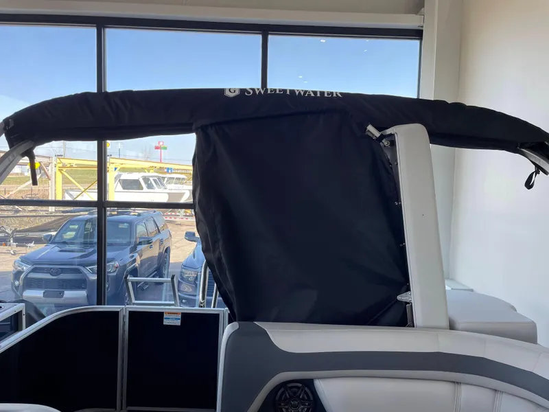 Slide: The Image of 2025 Godfrey Sweetwater 2086 C boat interior with covered canopy, showroom display. - 18